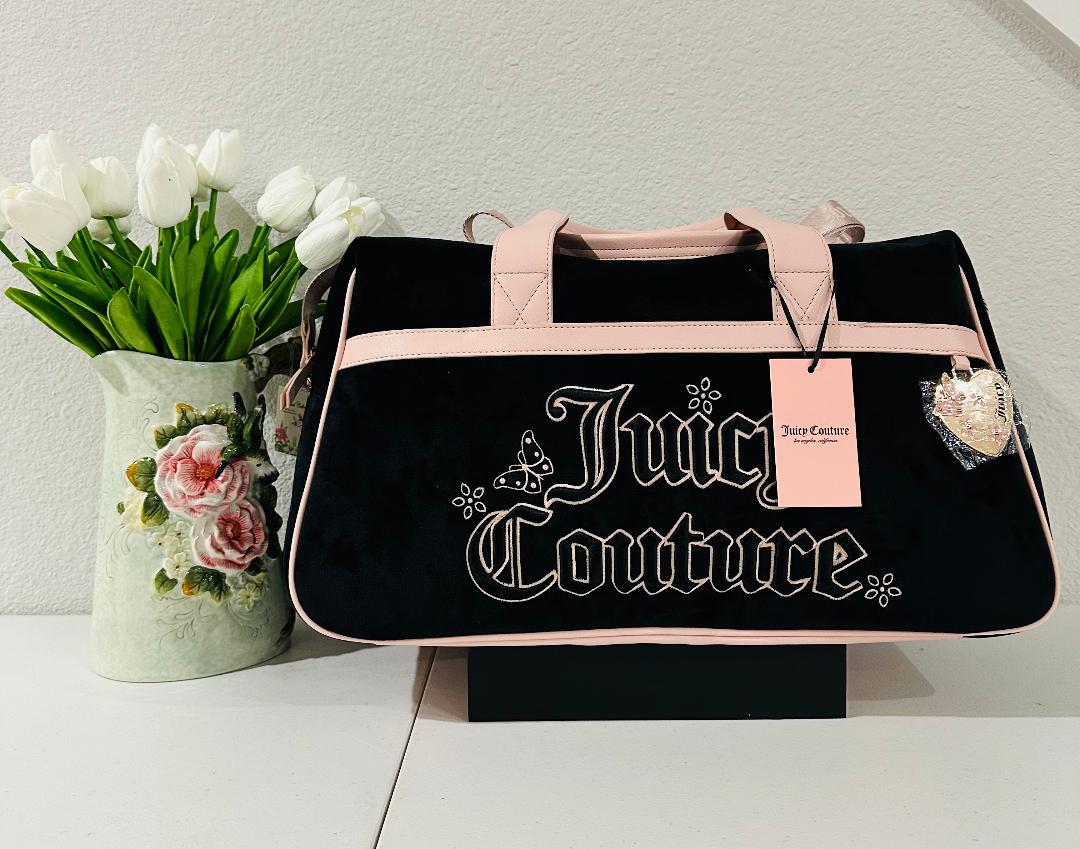 Black and Pink Juicy Couture Weekender bag with heart charm and crossbody strap