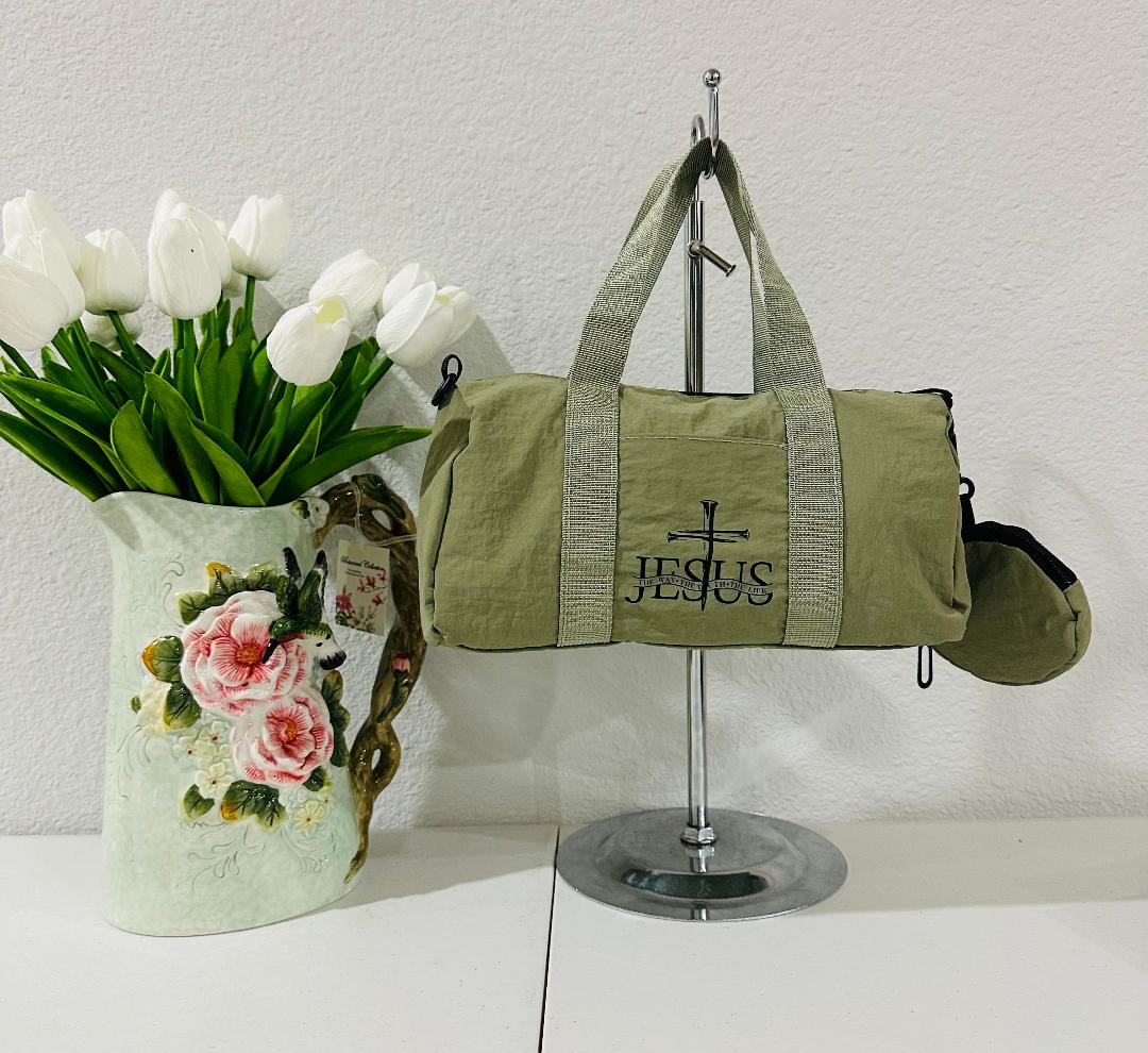 Olive green mini-Jesus duffle bag with crossbody strap and coin purse