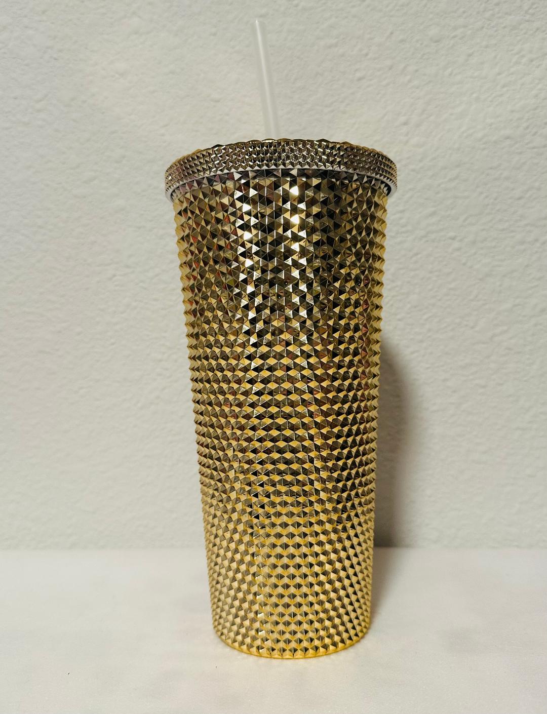 Gold tumbler with straw